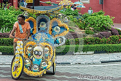 Colorful with soft toys decorated cycle rickshaw in Malacca, Malaysia. Editorial Stock Photo